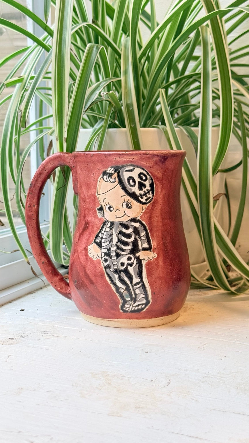 Kewpie Skelly mug with skeleton costume illustration